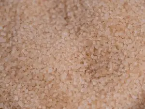 Macro capture of brown cane sugar showcasing texture and detail.